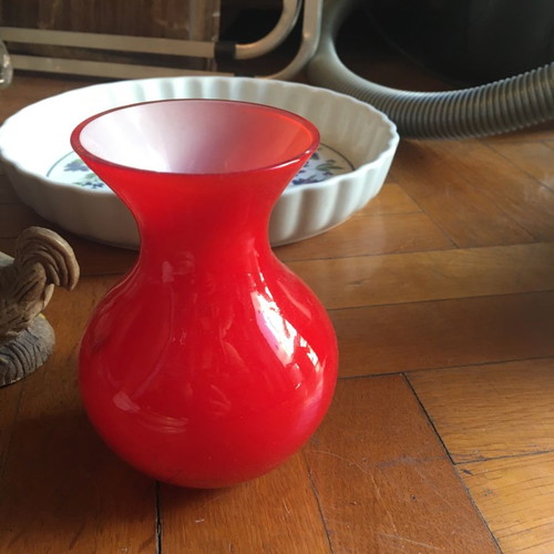 Glass vase used, red with white interior, two-tone