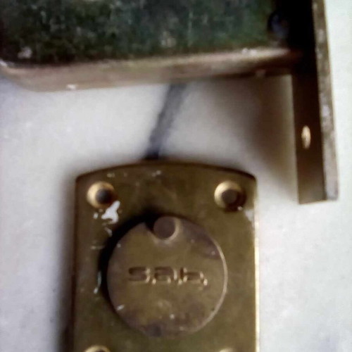 Triaina lock used with one key and metal keyhole cover