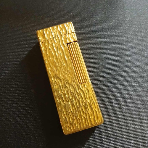 Dunhill Rollagas lighter used with goldplated finish and embossed design