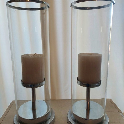Set of 2 used candlesticks with silver frame and transparent glass