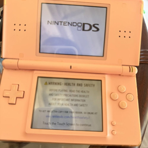 Nintendo DS used with 5 game cartridges and charger
