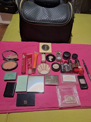 Large collection of branded cosmetics with YSL mirror and makeup bag