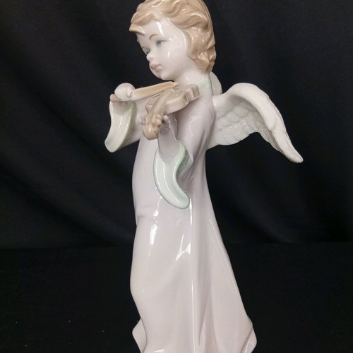 Porcelain angel figurine playing violin
