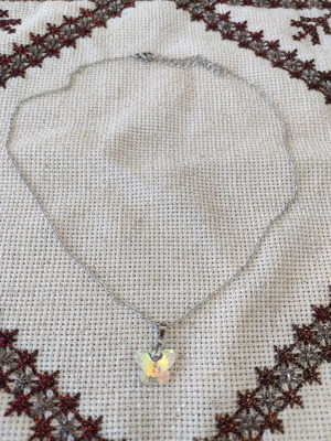 Necklace new with steel chain and crystal butterfly