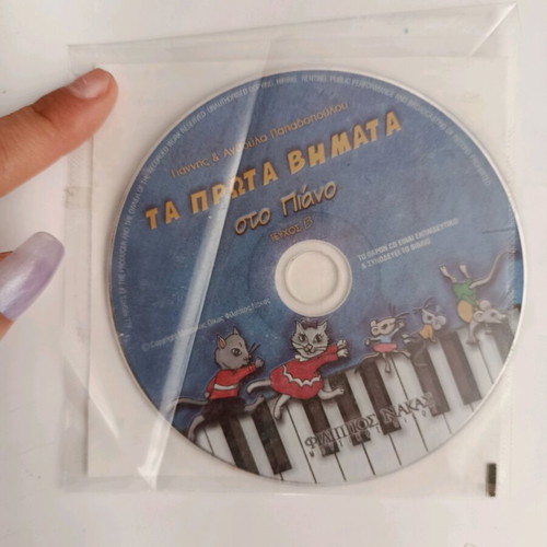 Piano learning books used, one with CD and one with writings
