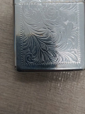 Zippo lighter used with small dent