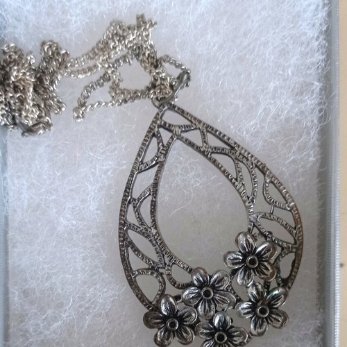 Chain with large motif used, silver with floral decoration