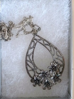Chain with large motif used, silver with floral decoration