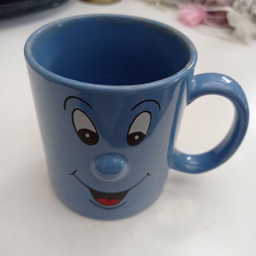 Mug cup with embossed nose face used