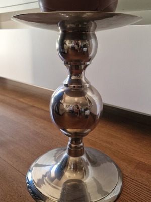 Metal candlestick used, silver color