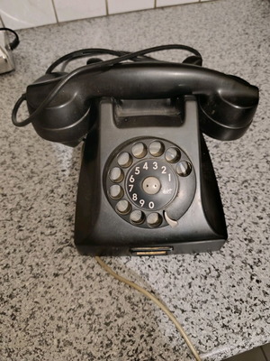 Vintage telephone used, black bakelite with rotary dial