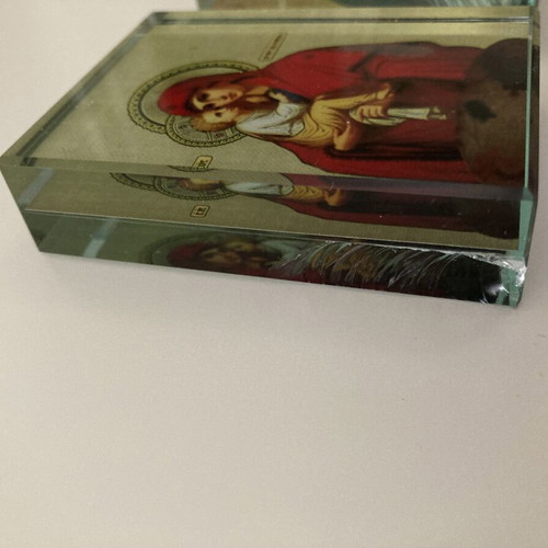 Glass religious icons used, set of two crystal blocks