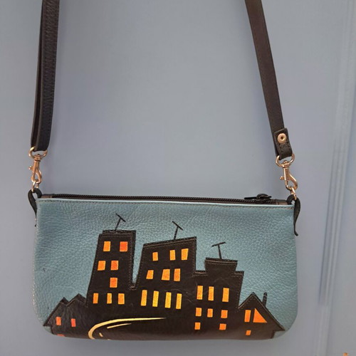 Handmade leather crossbody bag with urban design