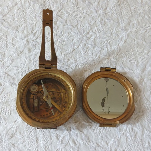 Vintage brass compass used with natural sine table