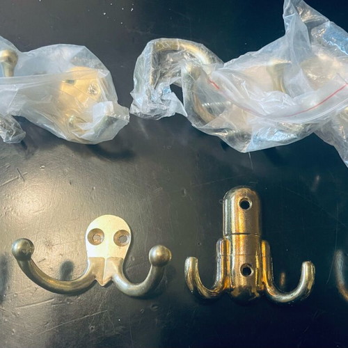 Double and single gold-coloured wall hooks