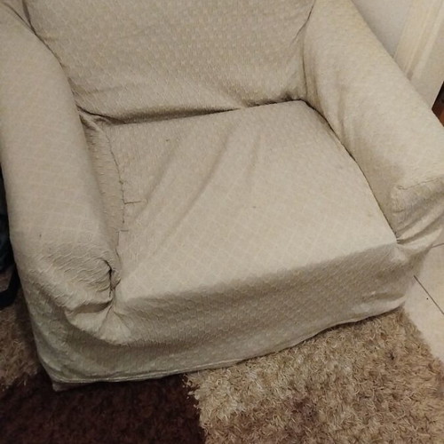 Armchair used with cover in good condition