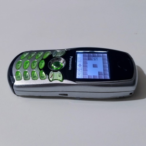 Panasonic EB-GD67 vintage cell phone used, silver, functional with charger