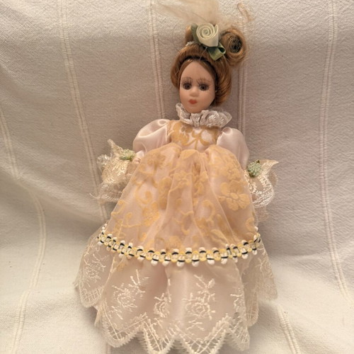 Porcelain doll vintage used, girl on stand