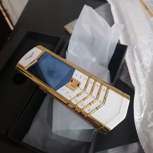 Vertu phone new, gold with metal leather body and dual card slot