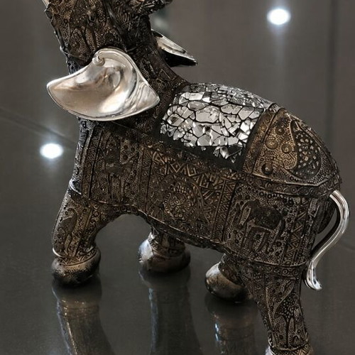 Decorative elephant vintage with embossed Asian-inspired carvings used