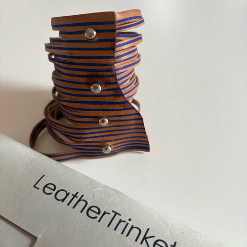 Leather bracelet used brown with blue details