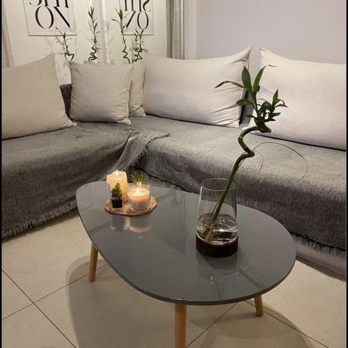 Coffee table new gray with glossy lacquer surface and solid legs
