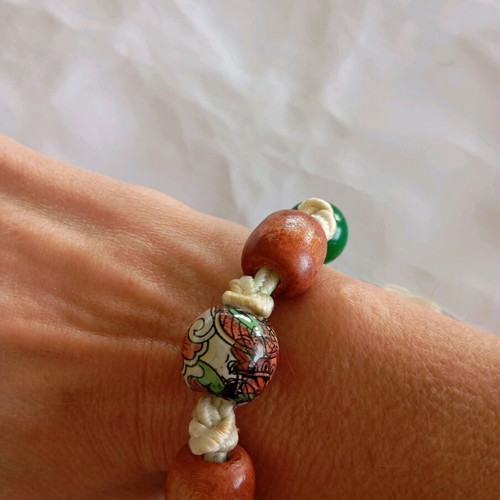 Handmade bracelet with cord and wooden beads green and brown