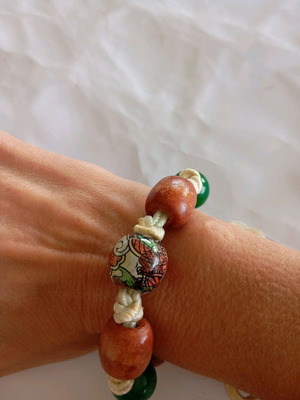 Handmade bracelet with cord and wooden beads green and brown