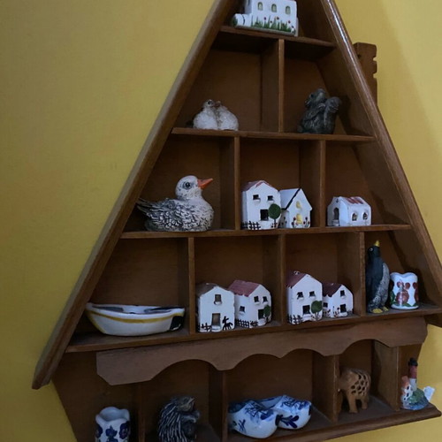 Decorative wall shelf with miniature collection case used