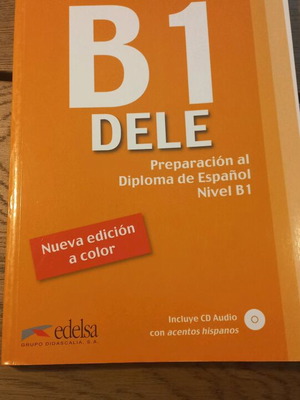 Spanish B1 test book used, with pencil-written exercises