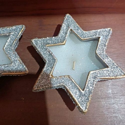 Christmas candles in clay stars with silver glitter new