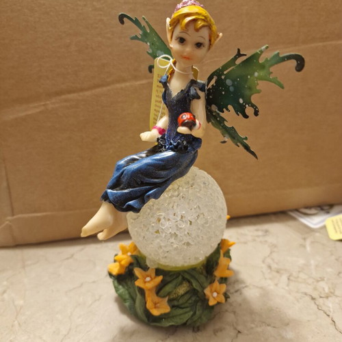 Decorative fairy on ball like new