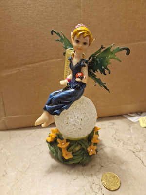 Decorative fairy on ball like new