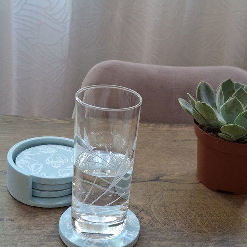 Handmade plaster coaster set with summer decoration and soft blue color