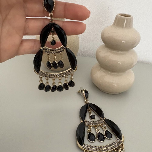 Dangling earrings used, large black and gold
