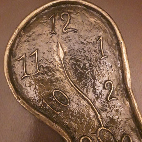 Dali wall sculpture bronze, like new, exact replica