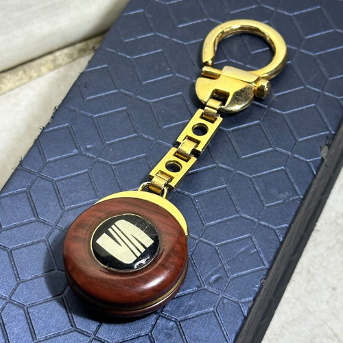 Vintage SEAT keychain used, bakelite with metal details