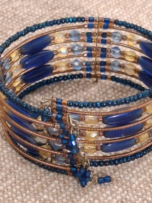 Spiral ethnic bracelet like new, blue and brown