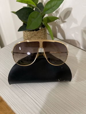 DKNY sunglasses used with worn plastic on the arms