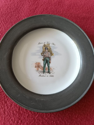 Decorative porcelain plate with pewter base like new