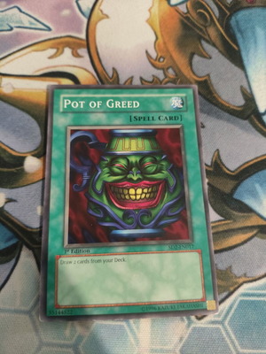 Pot of Greed Yu-Gi-Oh card used, moderate condition