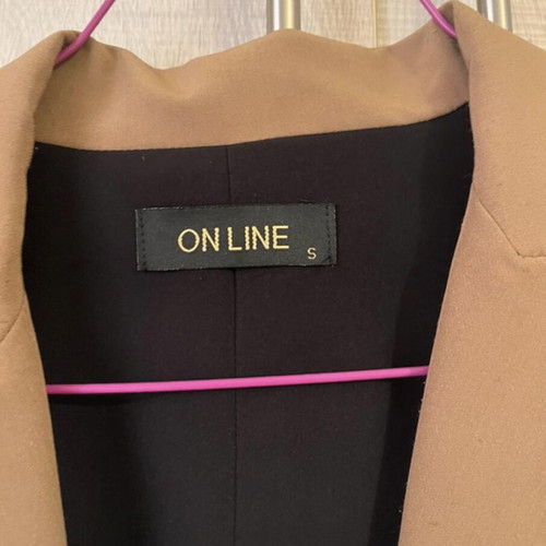 Sleeveless jacket used, black and tan, size small