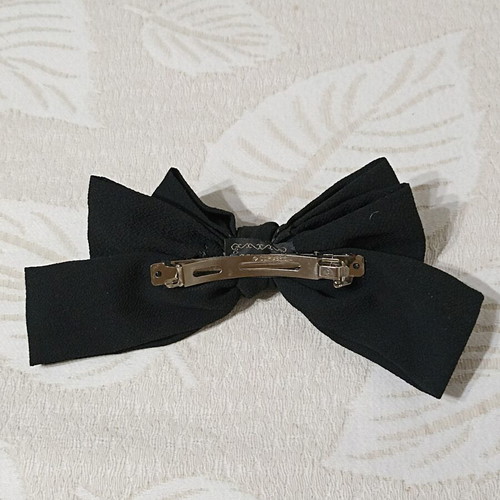 Women's bow hair clip like new, black