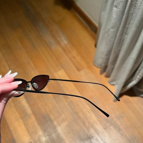 Sunglasses new with thin black frame and pink lens