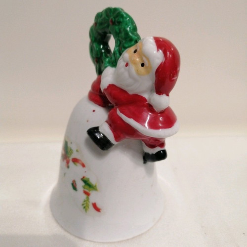 Ceramic bell like new with Santa Claus and wreath