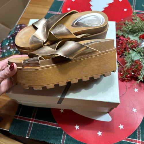 Gold flatforms used with thick treaded sole and wide straps