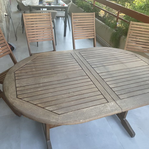 Wooden balcony table with four chairs used