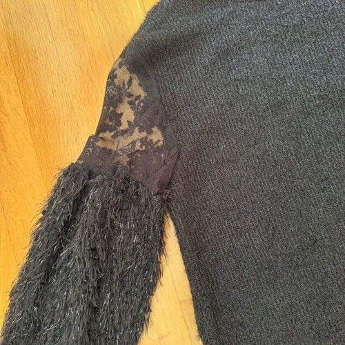 Knitted blouse like new with metallic thread and lace sleeves black