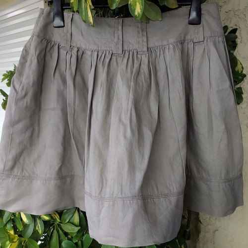 Sisley skirt used, sand color, with pockets and pleats