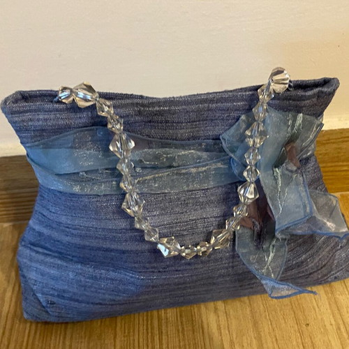 Small blue handbag new with ribbon and transparent beads
